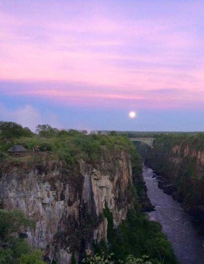 View of Victoria Falls Bridge under a full-moon.